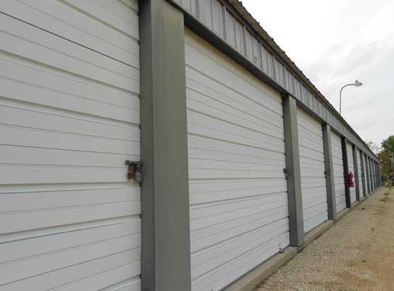 Close up of storage unit doors looking down the buildings side